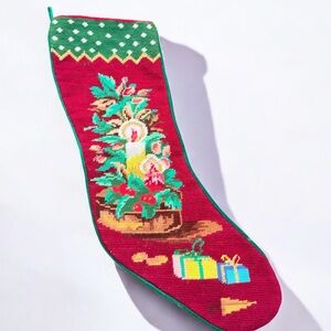 Vintage Christmas needlepoint stocking featuring a candle and presents design